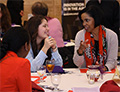 women conversing at a table