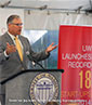 Governor Jay Inslee addresses an overflow crowd