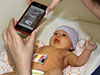 taking a picture of a baby with a smartphone