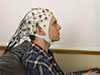 student with electroencephalography cap